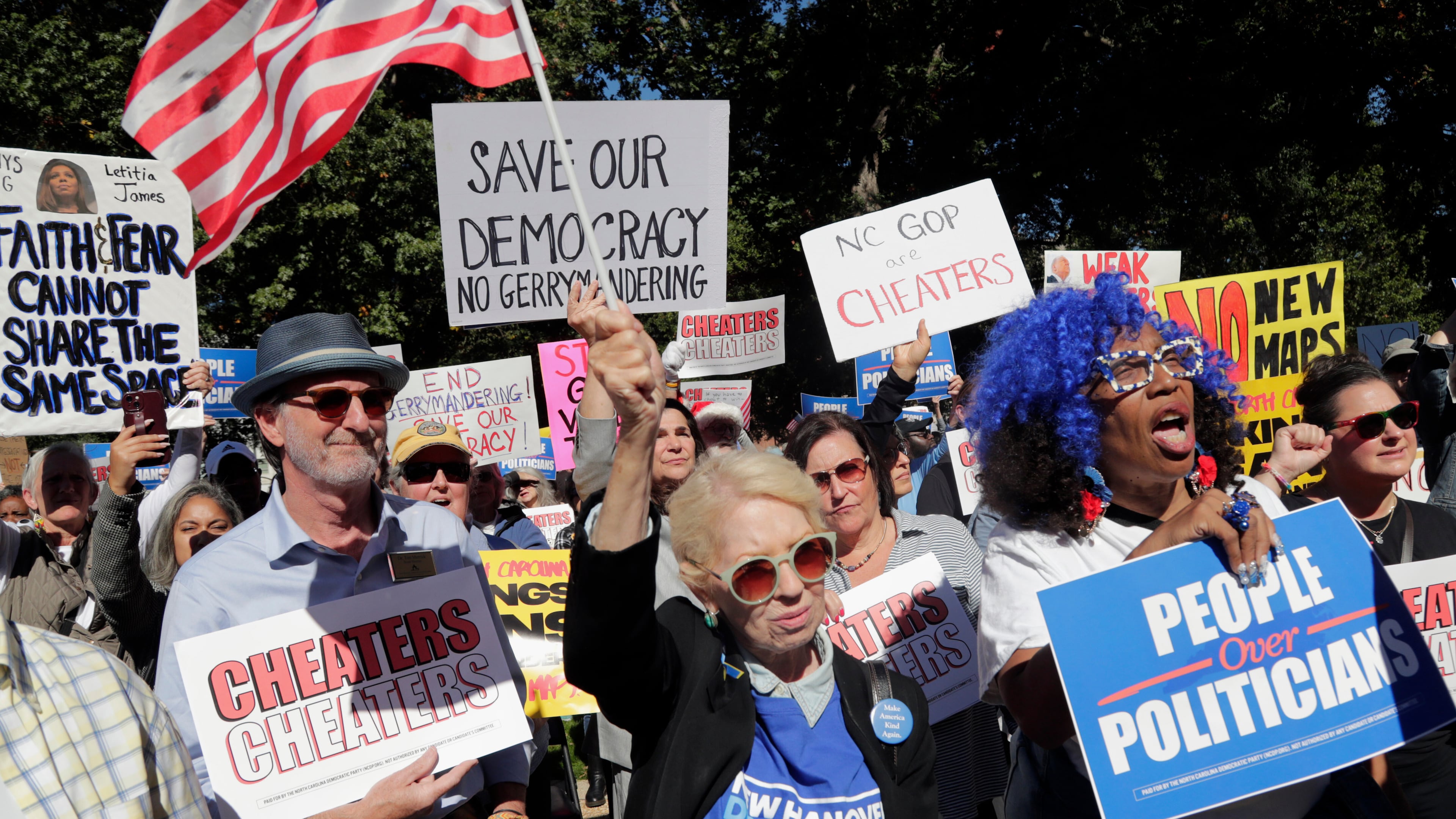 Attendees cheer during a rally protesting a proposed redistricting map Tuesday, Oct. 21, 2025, in Raleigh, N.C. (AP Photo/Chris Seward)