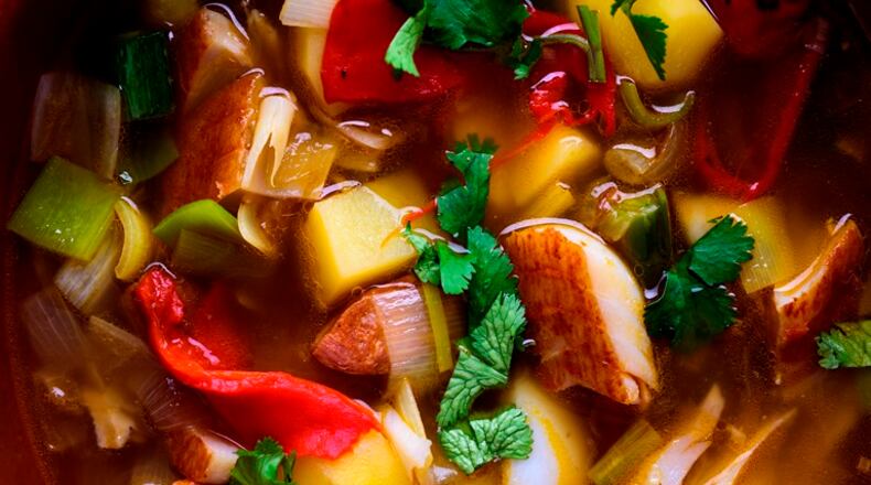 Smoked fish and potato soup with chorizo, piquillo peppers and cilantro, in New York, Nov. 16, 2015. Onions, potatoes, chorizo and smoked fish create “instant umami.”