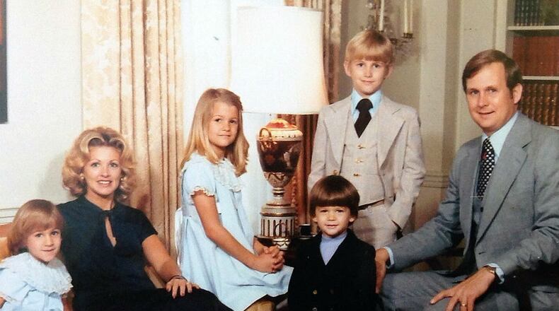 Orkin CEO Gary Rollins, on right, with his family in a photo from more than 30 years ago. All the others in the picture have since sued him and his brother Randall, Orkin's chairman, over their control of family assets.