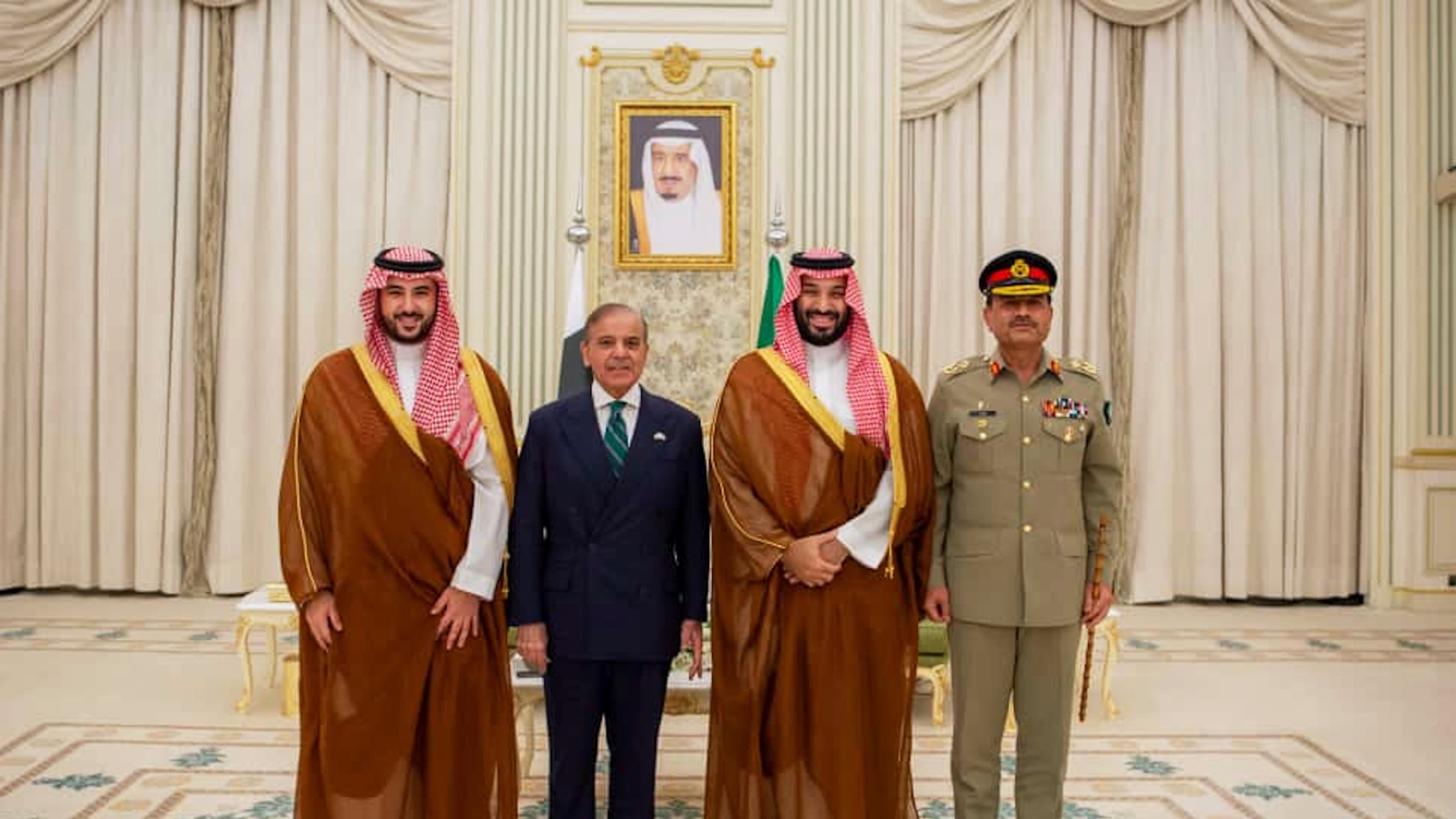 In this photo released by Pakistan's Press Information Department, Saudi Arabia's Crown Prince Mohammed bin Salman, second right, Saudi Arabia's Defence Minister Khalid bin Salman, left, Pakistan's Prime Minister Shehbaz Sharif, second left, and Pakistan's Army Chief Field Marshal Asim Munir, pose for photographs after signing a mutual defense pact, in Riyadh, Saudi Arabia, Wednesday, Sept. 17, 2025. (Press Information Department via AP)