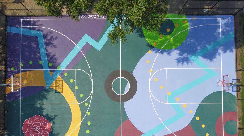 Elaine Stephenson (aka Artsy Elaine) is the artist behind Art in the Paint’s fifth mural which mimics the movement in basketball with abstract shapes. It's located in the West End.