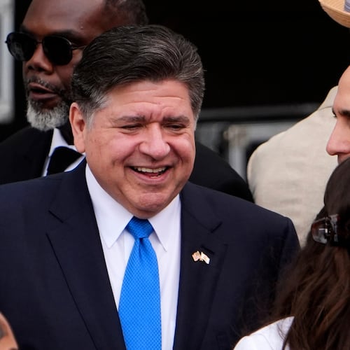 FILE - Illinois Gov. JB Pritzker, center, mingles ahead of the Obama Presidential Center dedication ceremony Thursday, June 18, 2026, in Chicago. (AP Photo/Jeff Roberson,File)