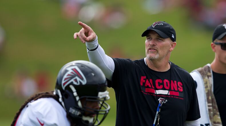 Dan Quinn gives instructions during Wednesday's training camp session.