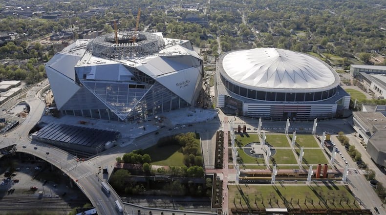 Traffic planning for the new Mercedes-Benz Stadium borrows successful ideas from other arenas and creates new ones unique to the venue. AJC file photo