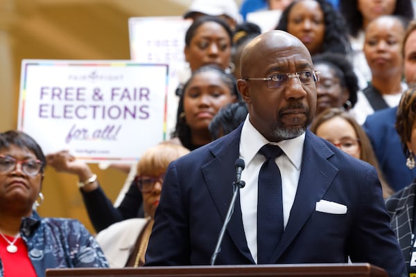 Democratic U.S. Sen. Raphael Warnock speaks at a news conference before the state Legislature convenes for a special session on Wednesday. (Arvin Temkar/AJC)
