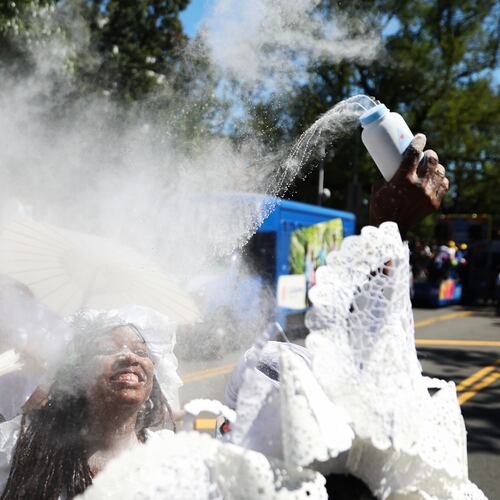 Members of the Belmont Baby Dolls throw baby powder as they wait for the start of the West Indian Day Parade on Monday, Sept. 7, 2026, in the Brooklyn borough of New York. (AP Photo/Heather Khalifa)