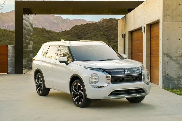 This photo provided by Mitsubishi shows the 2022 Outlander. The Outlander has a small third-row seat, but in exchange it's significantly less expensive than most other three-row SUVs. (Courtesy of Mitsubishi Motors USA via AP)