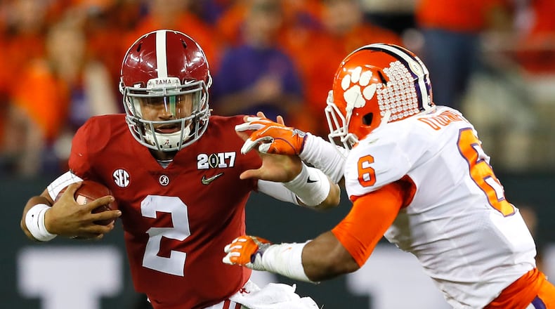 Alabama quarterback Jalen Hurts runs with the ball as Clemson linebacker Dorian O’Daniel attempts to tacke him during the first half of the College Football Playoff championship game at Raymond James Stadium on Monday night. (Photo by Kevin C. Cox/Getty Images)