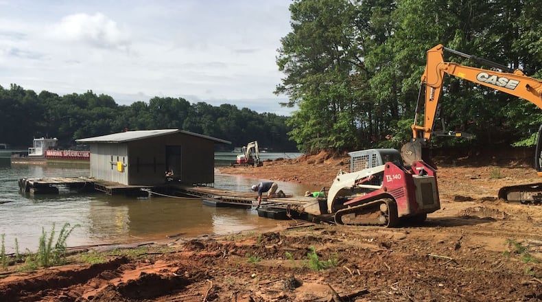 This abandoned houseboat was pulled from Lake Lanier in the Flat Creek area not far from the Forsyth County-Hall County line Tuesday, one of several such rusting vessels the Lake Lanier Association has pulled from the lake or shoreline this year.
