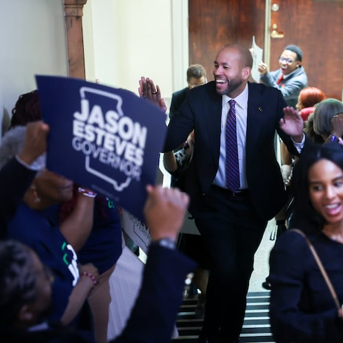 Democratic candidate for governor Jason Esteves is greeted by supporters as he enters to file paperwork to run for election at the Capitol in Atlanta on Monday, March 2, 2026. (Arvin Temkar/AJC)