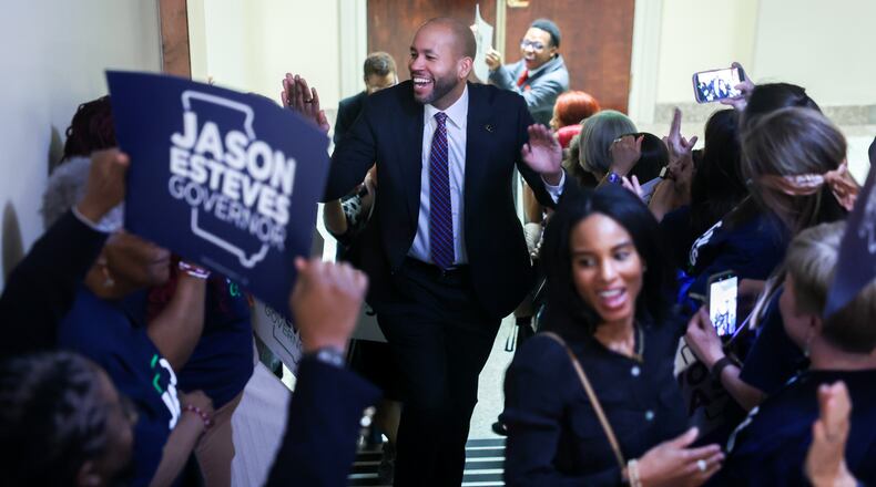 Democratic candidate for governor Jason Esteves is greeted by supporters as he enters to file paperwork to run for election at the Capitol in Atlanta on Monday, March 2, 2026. (Arvin Temkar/AJC)