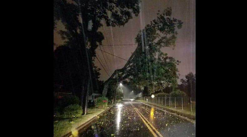 Fallen trees like this one in south Valdosta are causing power outages to half of all customers in Lowndes County, Georgia.