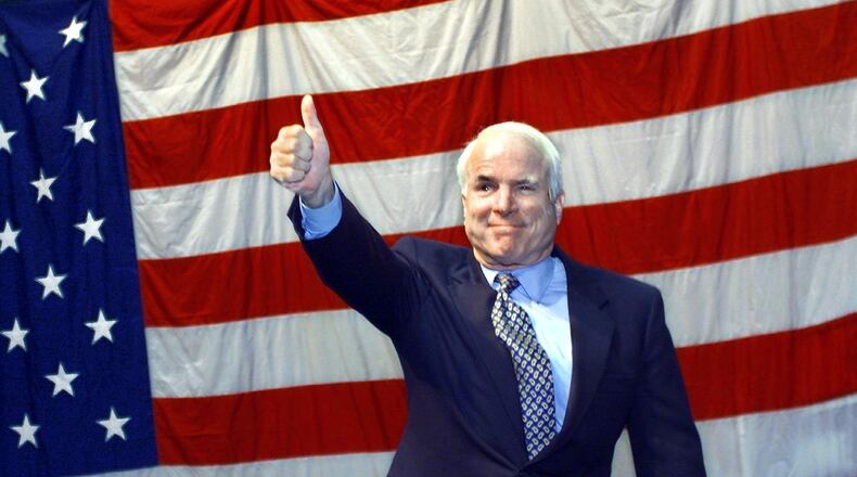 Former Republican presidential candidate U.S. Senator John McCain (R-AZ) waves to the crowd on Aug.11, 2000 at the University of Portland in Oregon. McCain was campaigning for Republican presidential nominee George W. Bush.