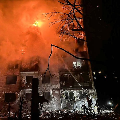 In this photo provided by the Ukrainian Emergency Service, emergency services personnel work to extinguish a fire following a Russian attack in Balakliya, Kharkiv region, Ukraine, Monday, Nov. 17, 2025. (Ukrainian Emergency Service via AP)