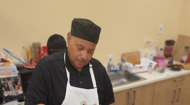 Musician and cook Mark Norwood leads cooking classes to teach adults about nutrition and saving money.