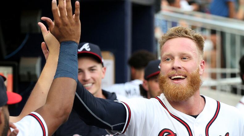 Braves pitcher Mike Foltynewicz is all smiles in the dugout after scoring a run during a July game at SunTrust Park. (Curtis Compton/ccompton@ajc.com)