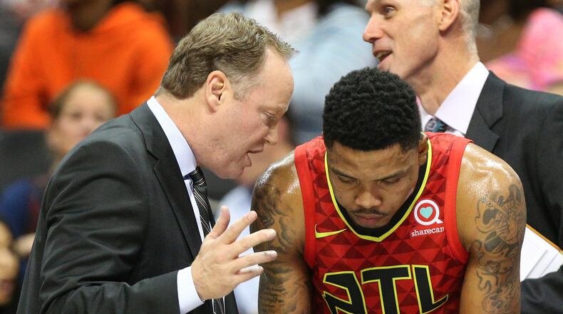November 30, 2017 Atlanta: Hawks head coach Mike Budenholzer confers with Kent Bazemore during a time out against the Cavaliers in a NBA basketball game on Thursday, November 30, 2017, in Atlanta. Curtis Compton/ccompton@ajc.com