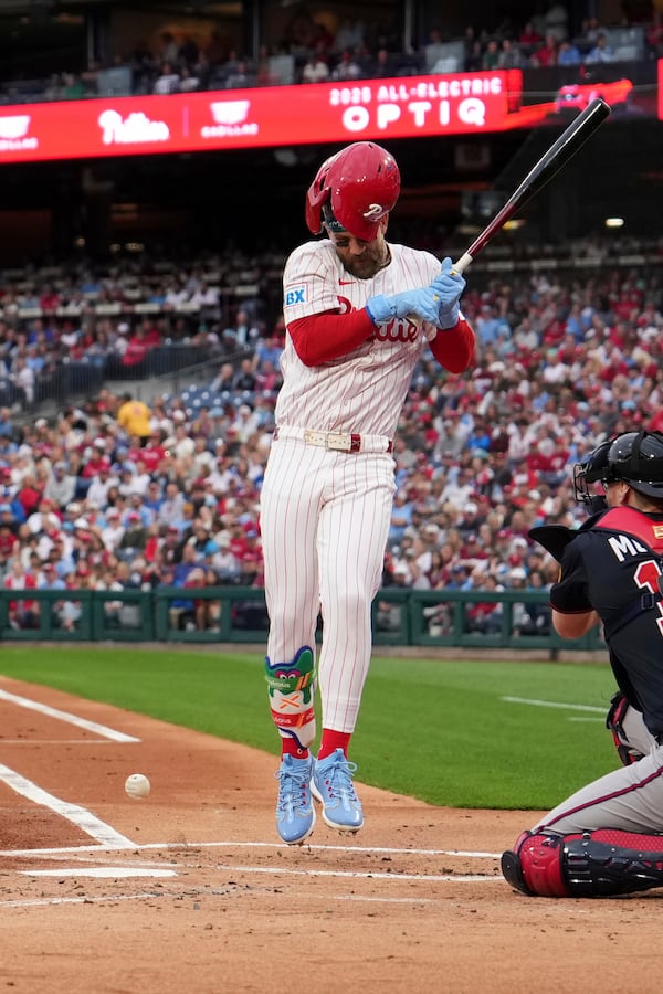 Philadelphia Phillies' Bryce Harper is hit by a pitch from Atlanta Braves' Spencer Strider during the first inning of a baseball game Tuesday, May 27, 2025, in Philadelphia. (AP Photo/Matt Slocum)
