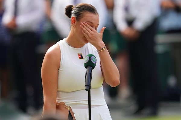 Amanda Anisimova of the U.S. reacts after losing the women's singles final match against Iga Swiatek of Poland at the Wimbledon Tennis Championships in London, Saturday, July 12, 2025.(AP Photo/Kirsty Wigglesworth)