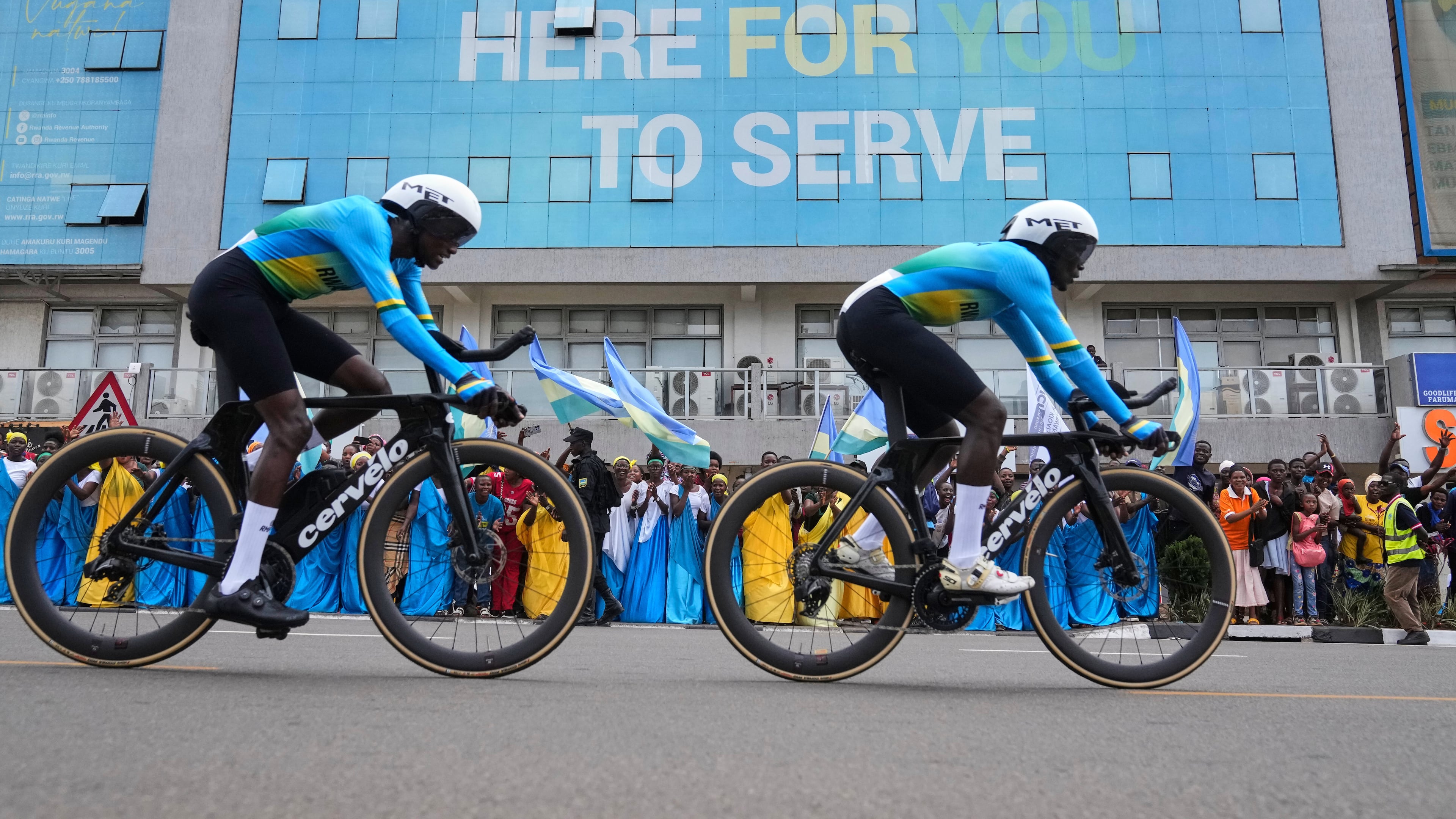 Team Rwanda competes, during the team time trial mixed relay event, at the road cycling World Championships in Kigali, Rwanda, Wednesday, Sept. 24, 2025. (AP Photo/Jerome Delay)