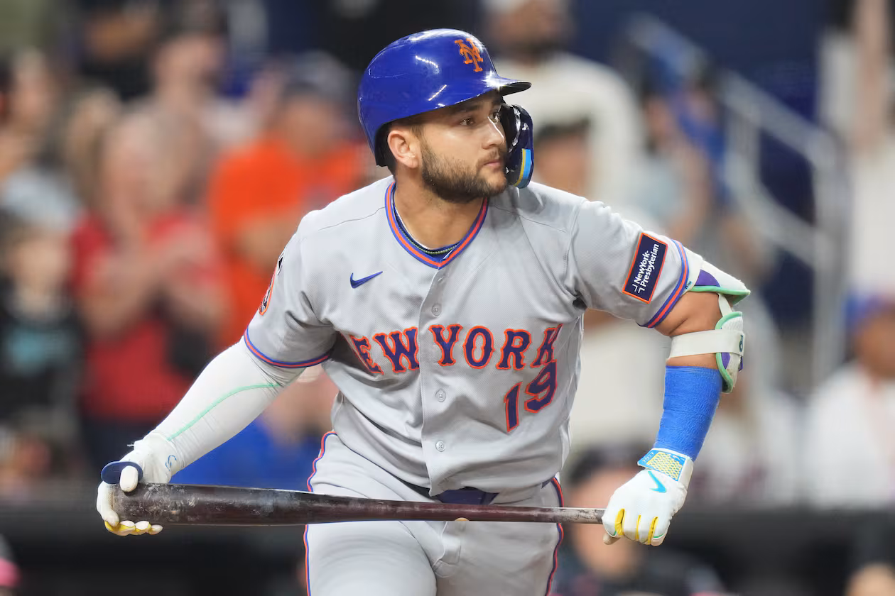 New York Mets' Bo Bichette watches as he flies out to center field during the ninth inning of a baseball game against the Miami Marlins, Friday, May 22, 2026, in Miami. (AP Photo/Lynne Sladky)