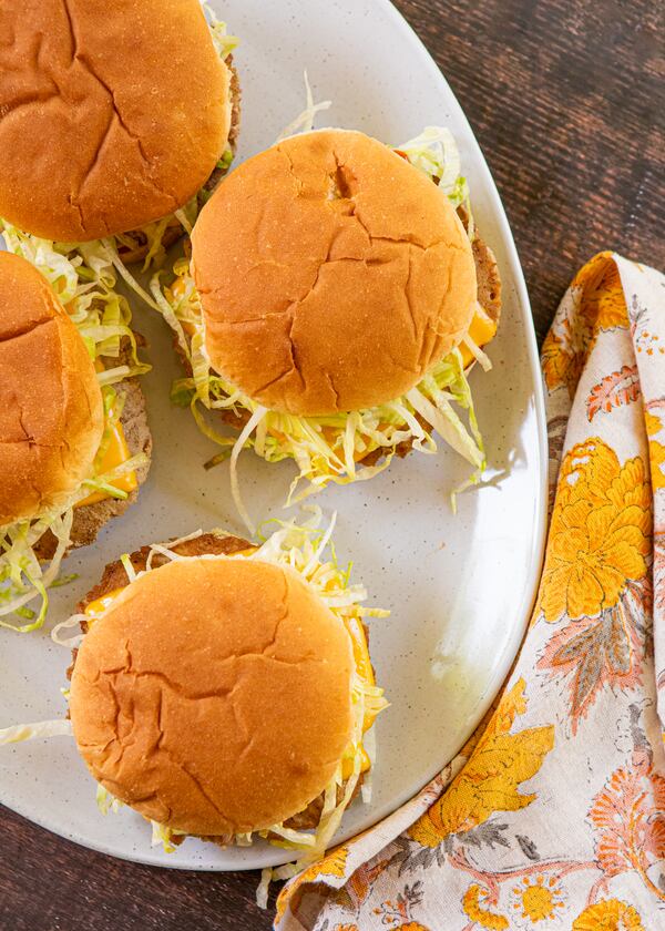 Add the turkey burger patties straight from the skillet to the buns, already assembled with toppings, and serve as soon as possible. (Aaliyah Man for the AJC/food styling by Kate Williams)