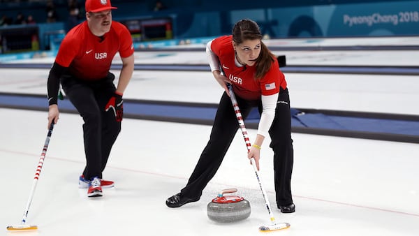 PYEONGCHANG-GUN, SOUTH KOREA - FEBRUARY 08:  Becca Hamilton and Matt Hamilton of the United States deliver a stone in the Curling Mixed Doubles Round Robin Session 1 during the PyeongChang 2018 Winter Olympic Games at Gangneung Curling Centre on February 8, 2018 in Pyeongchang-gun, South Korea.  (Photo by Ronald Martinez/Getty Images)