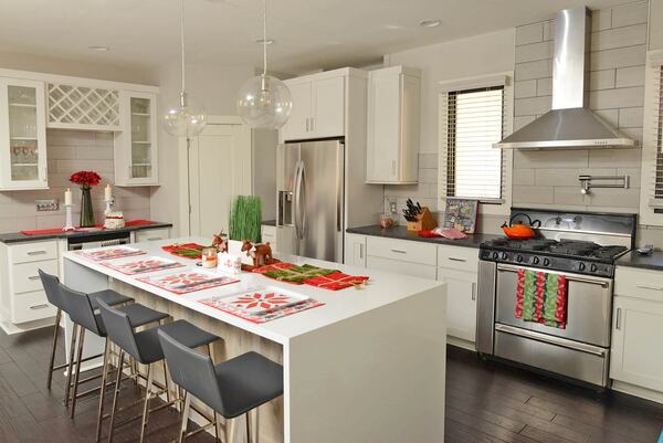 The renovated kitchen is modern and is open, a feature Megan Martin said she appreciates. The family can be in the same room when she's cooking and when the kids are doing homework or playing on their iPads, she said. The white quartz island has a waterfall design and serves as a spot for casual meals.