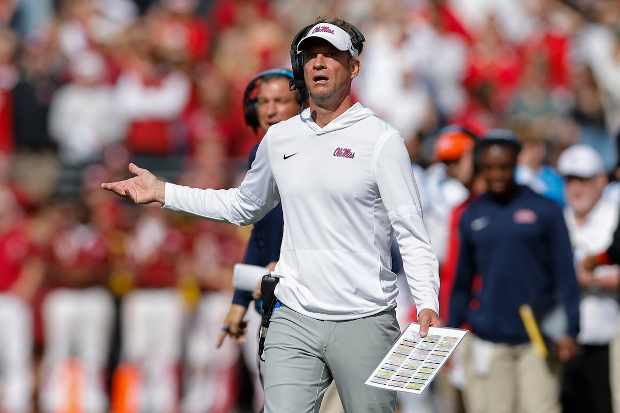 Ole Miss coach Lane Kiffin has led the Rebels into position to make the College Football Playoff, and some also consider him the leading candidate for the vacant coaching job at Florida. (Alonzo Adams/AP)