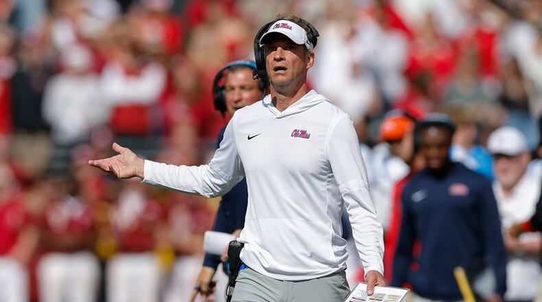Ole Miss coach Lane Kiffin has led the Rebels into position to make the College Football Playoff, and some also consider him the leading candidate for the vacant coaching job at Florida. (Alonzo Adams/AP)