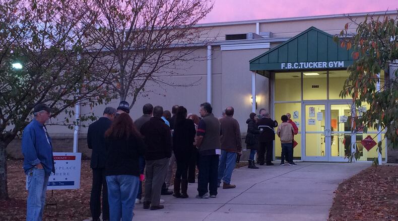 People line up to vote before the polls open at the Tucker precinct on Main Street in the DeKalb County city. JOSHUA SHARPE/JOSHUA.SHARPE@AJC.COM