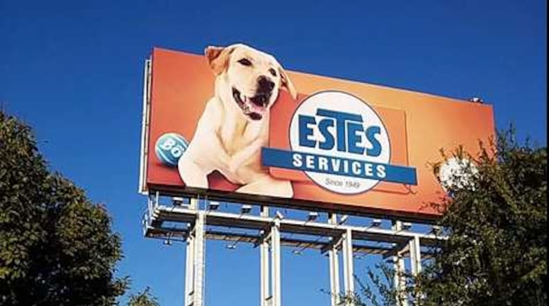 Bo, a yellow lab featured on an Estes Services billboard alongside I-85 in Buckhead, has become something of an icon.