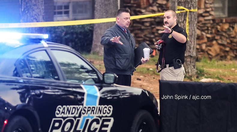 Sandy Springs police officers investigate an officer-involved shooting on Northwood Drive on Thursday morning.
