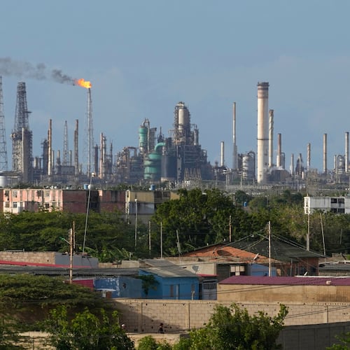 FILE - Flames rise from flare stacks at the Amuay refinery in Los Taques, Venezuela, Jan. 14, 2026. (AP Photo/Matias Delacroix, File)