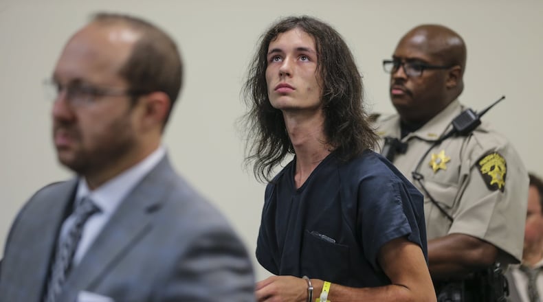 With his attorney, Lawrence Zimmerman (left), and Fulton County sheriff's deputy M. Johnson standing post (right), Jeffrey Hazelwood makes his first court appearance on Aug. 5. Hazelwood is accused in the fatal shootings of two Roswell teenagers behind a supermarket. JOHN SPINK /JSPINK@AJC.COM