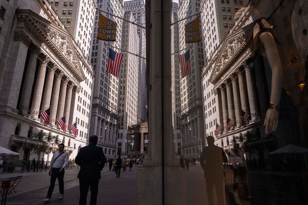 A reflection of a window shows the New York Stock Exchange on Monday, June 30, 2025, in New York. (AP Photo/Yuki Iwamura)