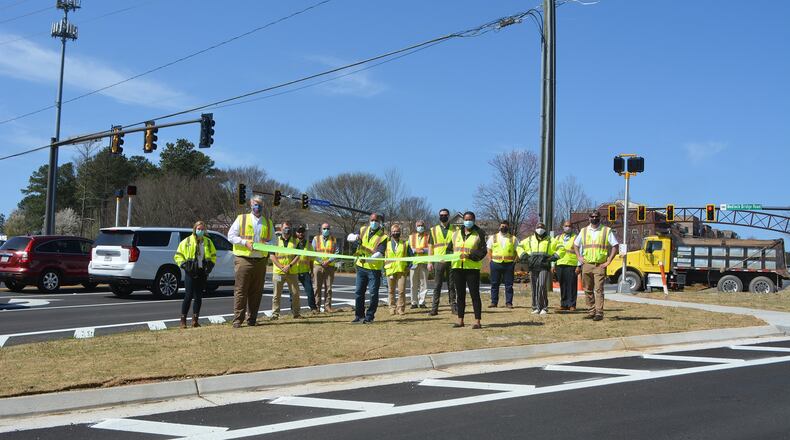 Johns Creek’s Council Member Brian Weaver joined the city’s Public Works team to celebrate the completion of the Bell Road at Medlock Bridge Road TSPLOST project. (Courtesy City of Johns Creek)