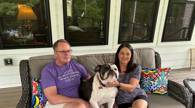GHSA executive director Robin Hines and wife Kim, along with bulldog Elvis, enjoy the back deck on their home at Lake Hartwell.