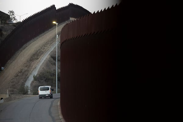 FILE— A Border Patrol van transports a group of migrants, Jan. 21, 2025, after they crossed illegally between two border walls separating Mexico and the United States in San Diego, Texas. (AP Photo/Gregory Bull, File)