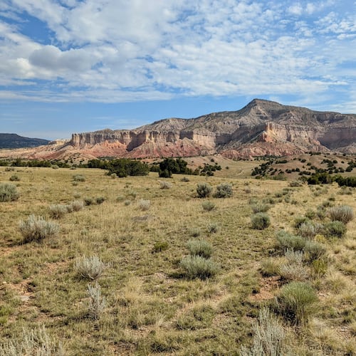 In this photo provided by Jonathan Hayden is the Ghost Ranch landscape, on July 18, 2025, near Abiguiu, N.M. A new conservation agreement announced Tuesday, Dec. 9, preserves land with breathtaking desert vistas in New Mexico near Abiquiu that inspired the work of 20th century painter Georgia O'Keeffe. (Jonathan Hayden via AP)