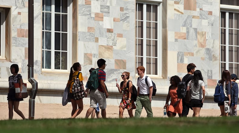 September 11, 2012 - Atlanta, Ga.: Emory University students walk by the Pitts Theology Library on campus during fall classes Tuesday afternoon in Atlanta, Ga., September 11, 2012. A report released this week ranks Emory University third among U.S. campuses for the rate of reported forcible sex offenses on campus. JASON GETZ / JGETZ@AJC.COM