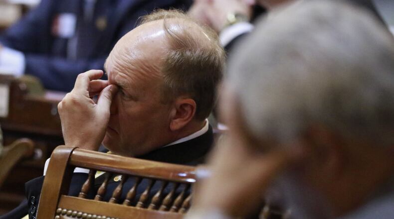State Rep. Dan Gasaway, R-Homer, (left) and state Rep. “Coach” Williams, D-Avondale Estates, during extended debate in the state House in 2016. BOB ANDRES / BANDRES@AJC.COM