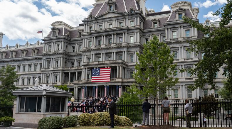 The Eisenhower Executive Office Building is seen as President Donald Trump speaks during an event to announce the Freedom Haulers initiative at the White House, Thursday, July 30, 2026, in Washington. (AP Photo/Julia Demaree Nikhinson)