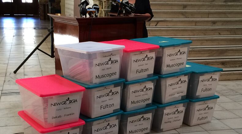 Copies of 2014 voter registration files turned over to the state by the New Georgia Project. KRISTINA TORRES / KTORRES@AJC.COM