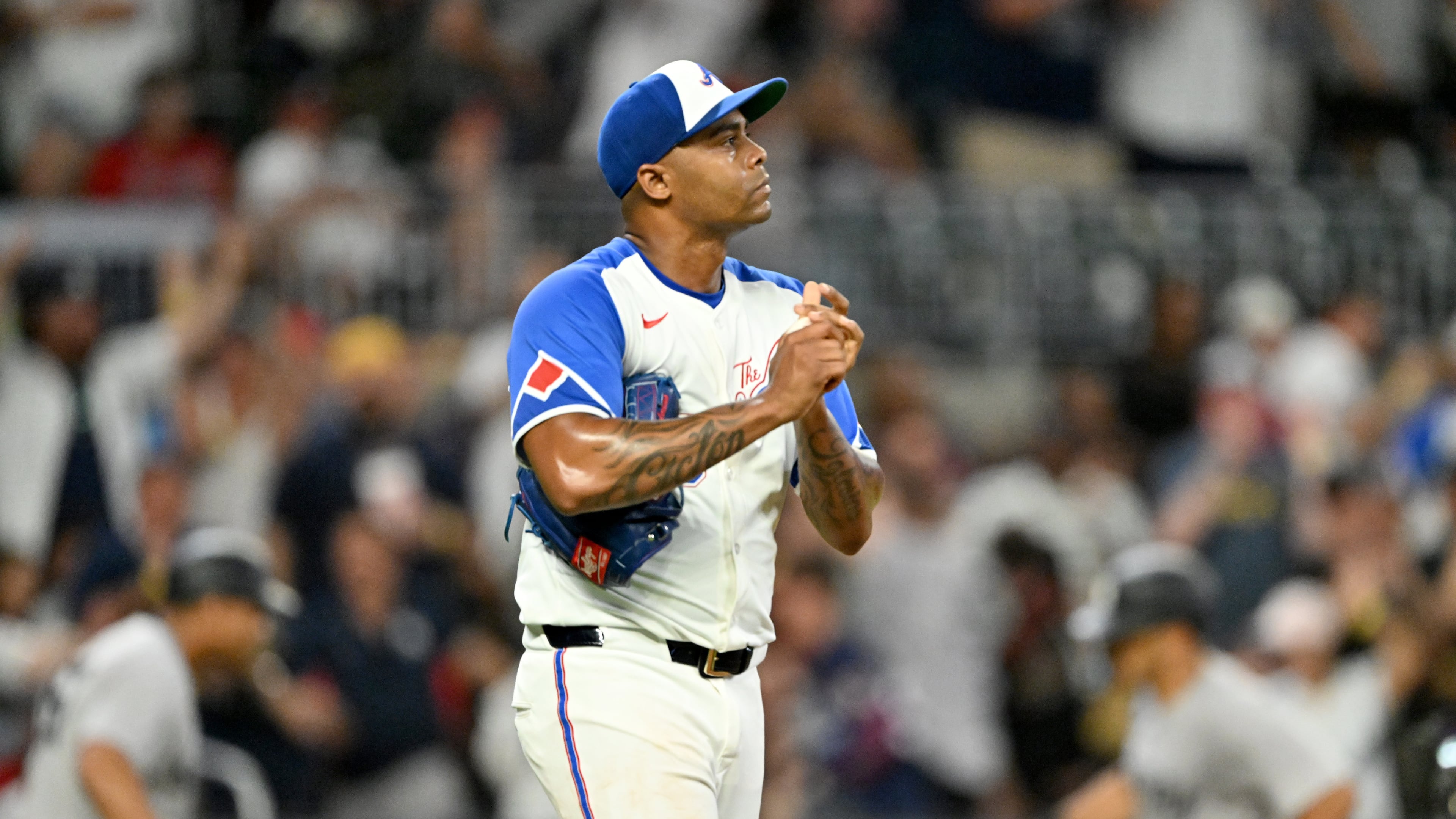 Atlanta Braves pitcher Raisel Iglesias reacts after allowing a grand slam by New York Yankees outfielder Trent Grisham during the ninth inning of a baseball game at Truist Park, Saturday, July 19, 2025, in Atlanta. The Braves lost 12-9. (Hyosub Shin/AJC)