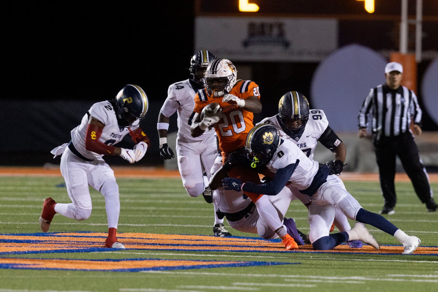 North Cobb’s Zach Belyeu (20) is tackled. (Photo/Jenn Finch, AJC)