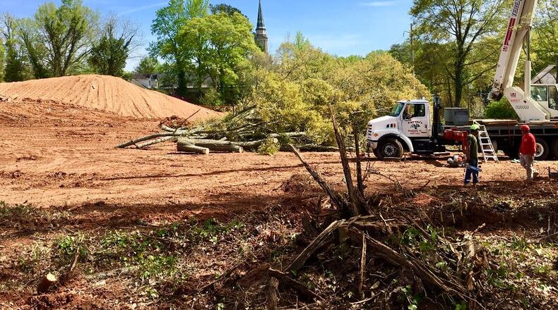 This is where the development called “Hargrove” will get built with the initial homeowners expected to begin closing in December. Despite appearances Decatur’s arborist says the developer is adhering to the city’s tree ordinance by saving a handful of trees (to the right and left in this photo) and planning to replant a 45 percent canopy. Bill Banks for the AJC