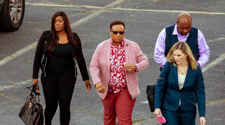 Mitzi Bickers, second from left, heads towards the Atlanta Federal Courthouse Thursday, March 3, 2022, for a pre-trial conference. STEVE SCHAEFER FOR THE ATLANTA JOURNAL-CONSTITUTION