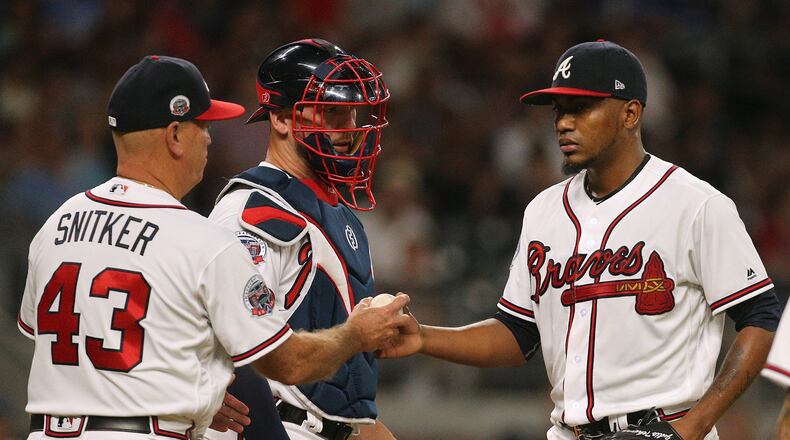 Braves manager Brian Snitker pulls Julio Teheran from the game Thursday against the Blue Jays, when the pitcher allowed nine runs and three homers and left without recording an out in the fourth inning. (Curtis Compton/ccompton@ajc.com)
