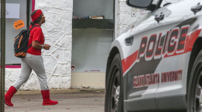 Atlanta: Clark Atlanta University police keep an eye on student pedestrian traffic along James P. Brawley Drive at Parsons Street in November 2015 after several women, including some students, reported being robbed at gunpoint and pepper sprayed over the weekend on or near Clark Atlanta Universityâs campus. Clark Atlanta police increased patrols, and an alert was sent to students. AJC File Photo.